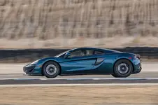 2017-McLaren-570GT-side-in-motion.webp