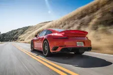 2017-Porsche-911-Turbo-S-rear-three-quarter-in-motion-01.webp