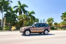 7120-bmw-x5-4-4i-neiman-marcus-impala-brown-2250px.webp