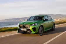 -m35i-xdrive-frozen-tampa-bay-green-driving-2248px.webp