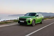 -m35i-xdrive-frozen-tampa-bay-green-driving-2248px.webp