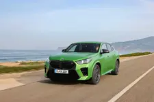 -m35i-xdrive-frozen-tampa-bay-green-driving-2248px.webp