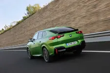 -m35i-xdrive-frozen-tampa-bay-green-driving-2248px.webp