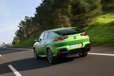 -m35i-xdrive-frozen-tampa-bay-green-driving-2248px.webp